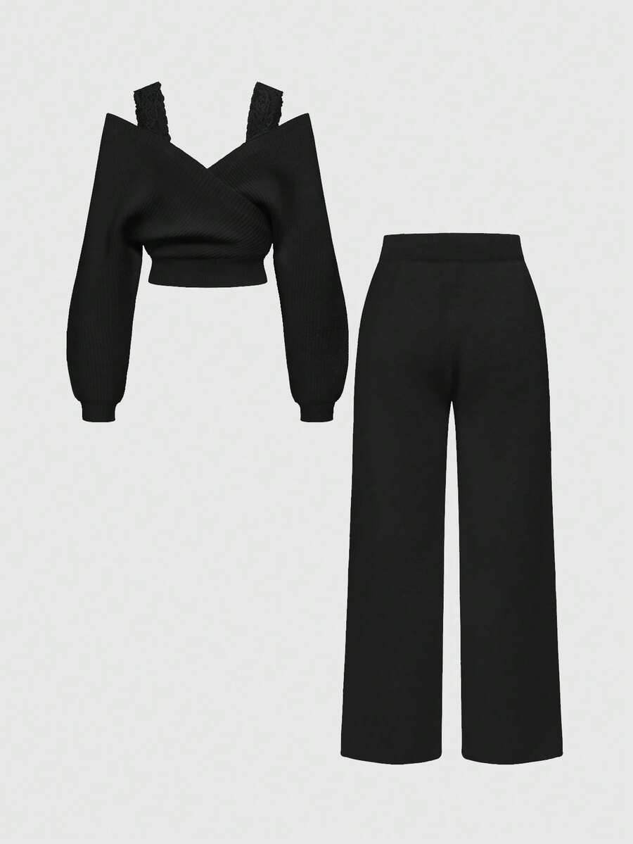 Women's two-piece rib-knit sweater set featuring a long-sleeve cold-shoulder crop top with strap details and matching wide-leg pants.