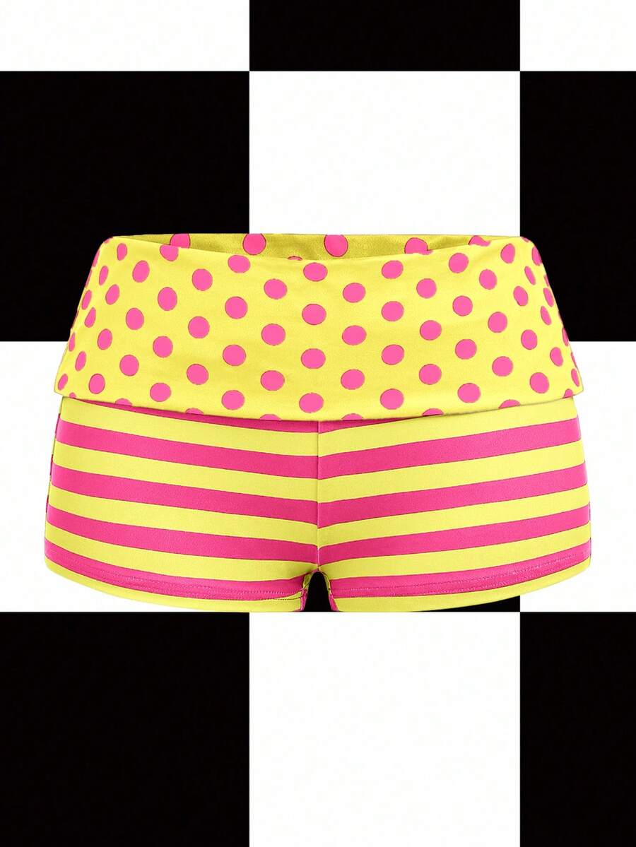 Women's black low waist mini track shorts with contrast polka dot, striped, geometric, and plant-inspired print details, elastic waistband, and skinny fit
