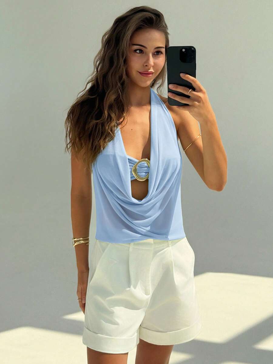 Semi-sheer plunging halter backless top with draped knot details and metallic decor, shown as a short slim-fit mesh going-out top.