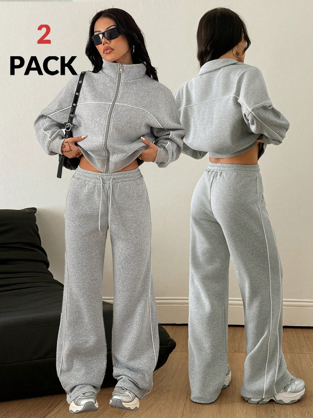 Women's two-piece casual set featuring a long sleeve zip-front hoodie and matching drawstring pants.