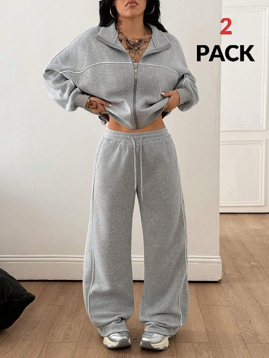 Women's two-piece casual set featuring a long sleeve zip-front hoodie and matching drawstring pants.