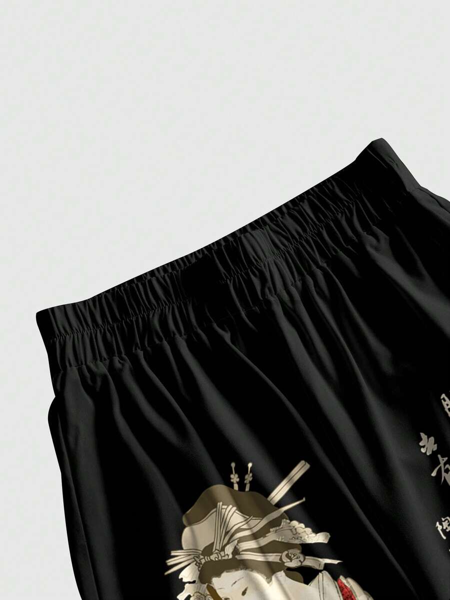 Women's black long wide leg pants with white calligraphy graphic print and an elastic mid-rise waistband.