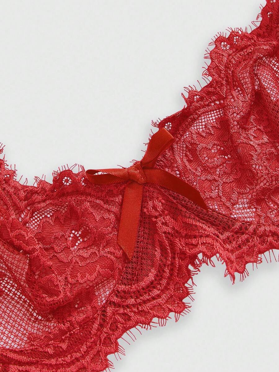 Sheer floral lace underwire triangle bra for women featuring adjustable straps and plunge cup design.