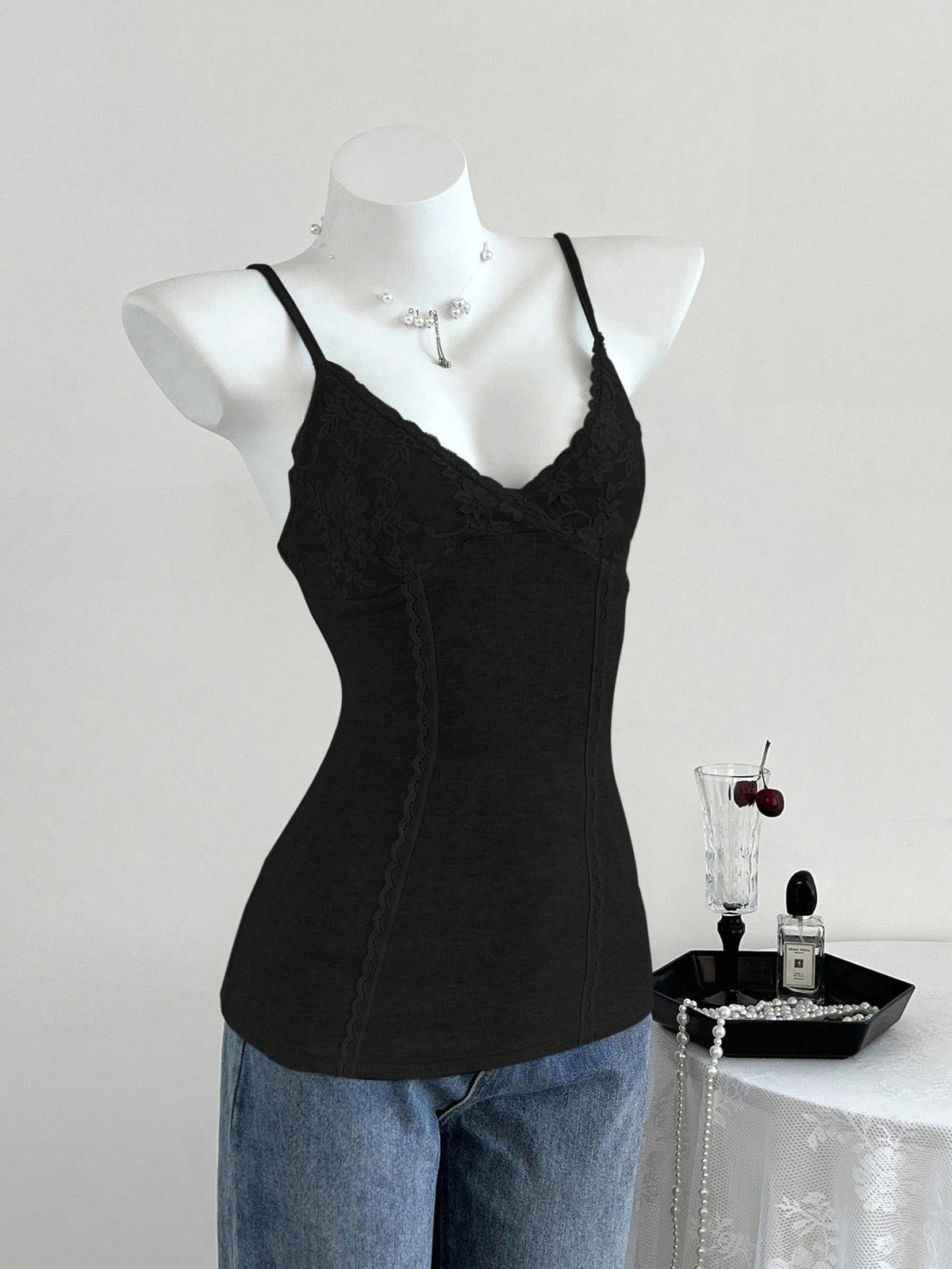 Women's slim fit backless cami tank top with contrast lace patchwork details, spaghetti straps, and high-stretch knitted ribbed fabric.