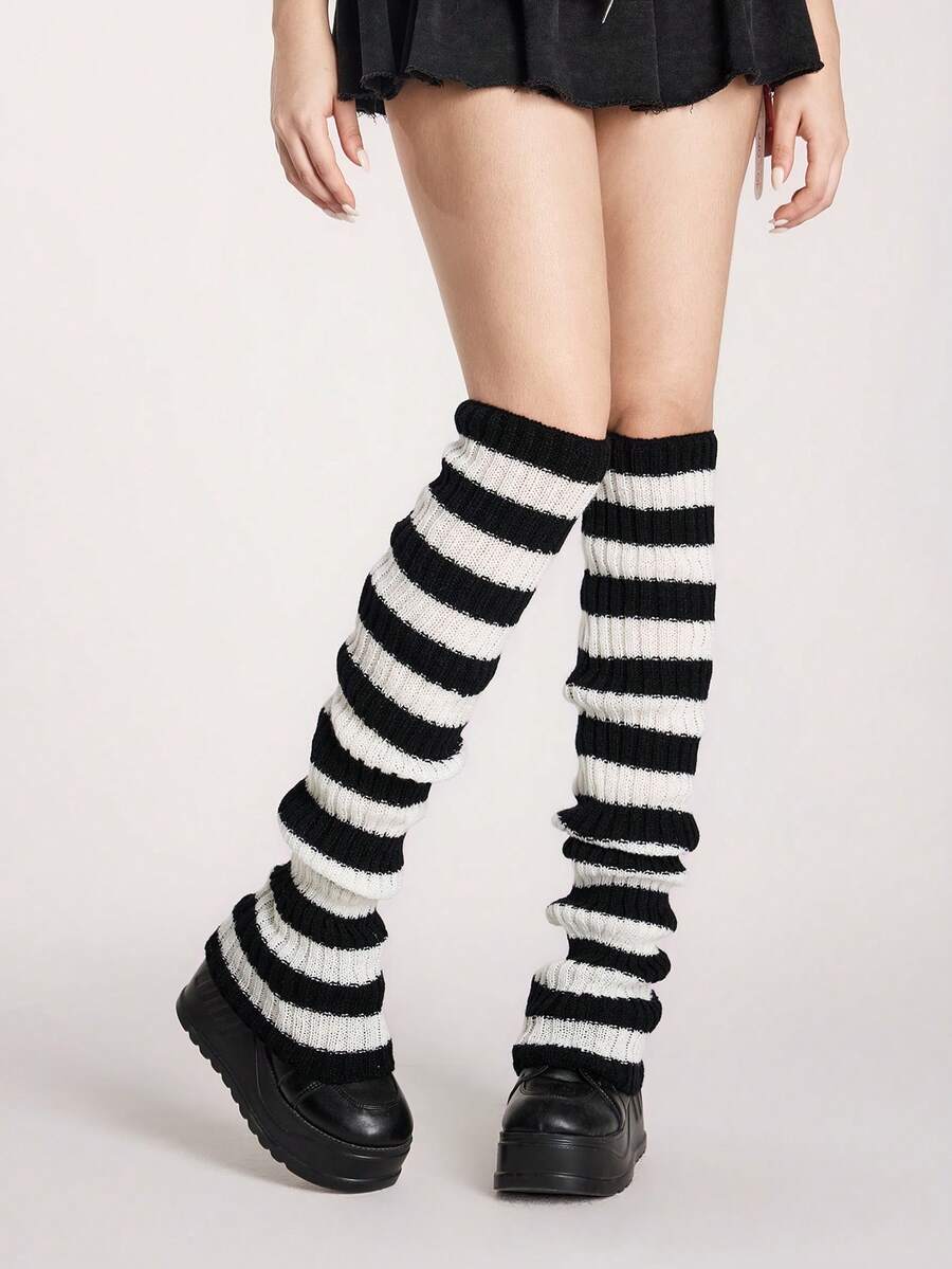 Pair of women's extra long knitted leg warmers featuring a gothic grunge design with subtle ruffle detailing.
