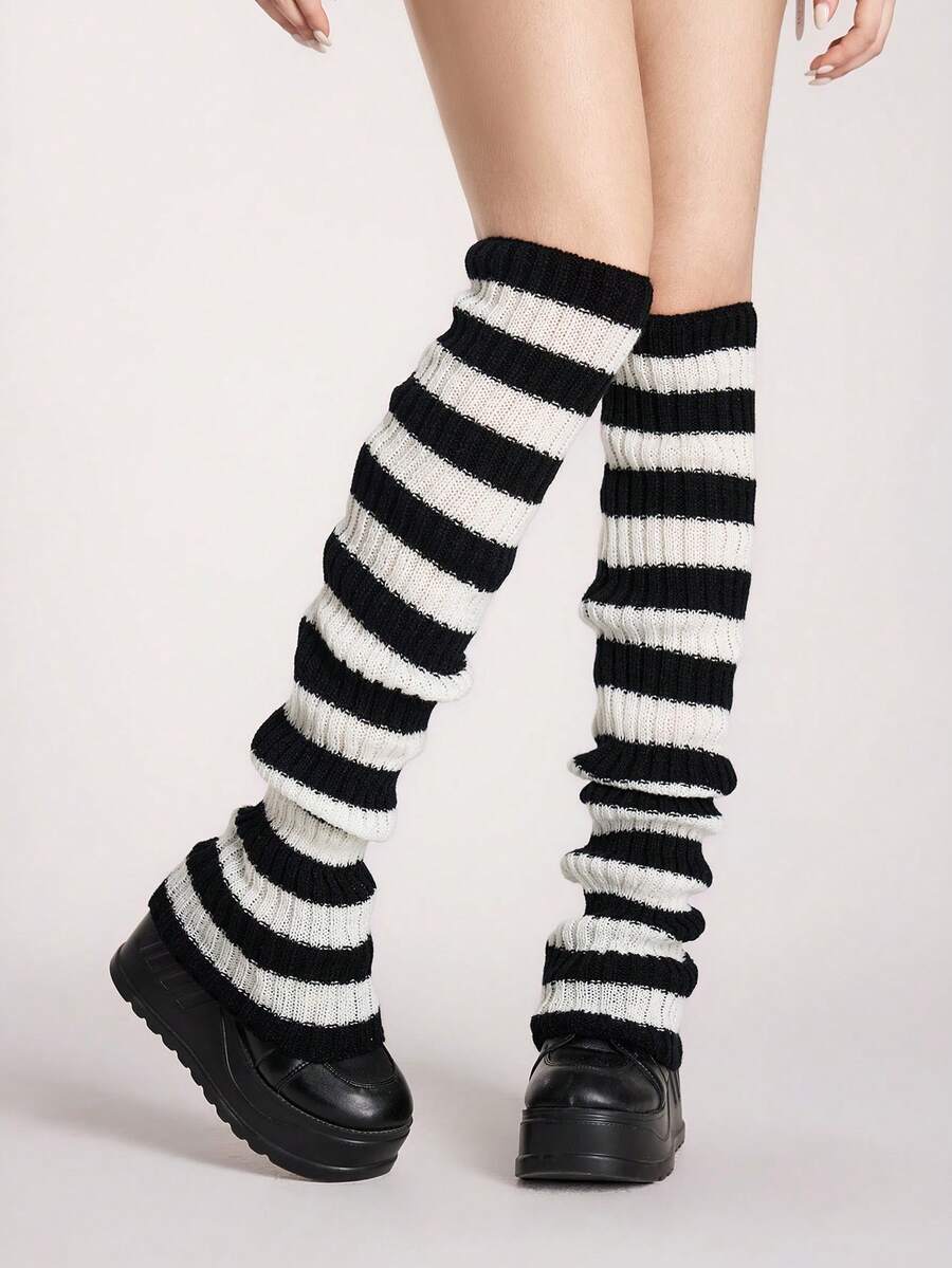 Pair of women's extra long knitted leg warmers featuring a gothic grunge design with subtle ruffle detailing.