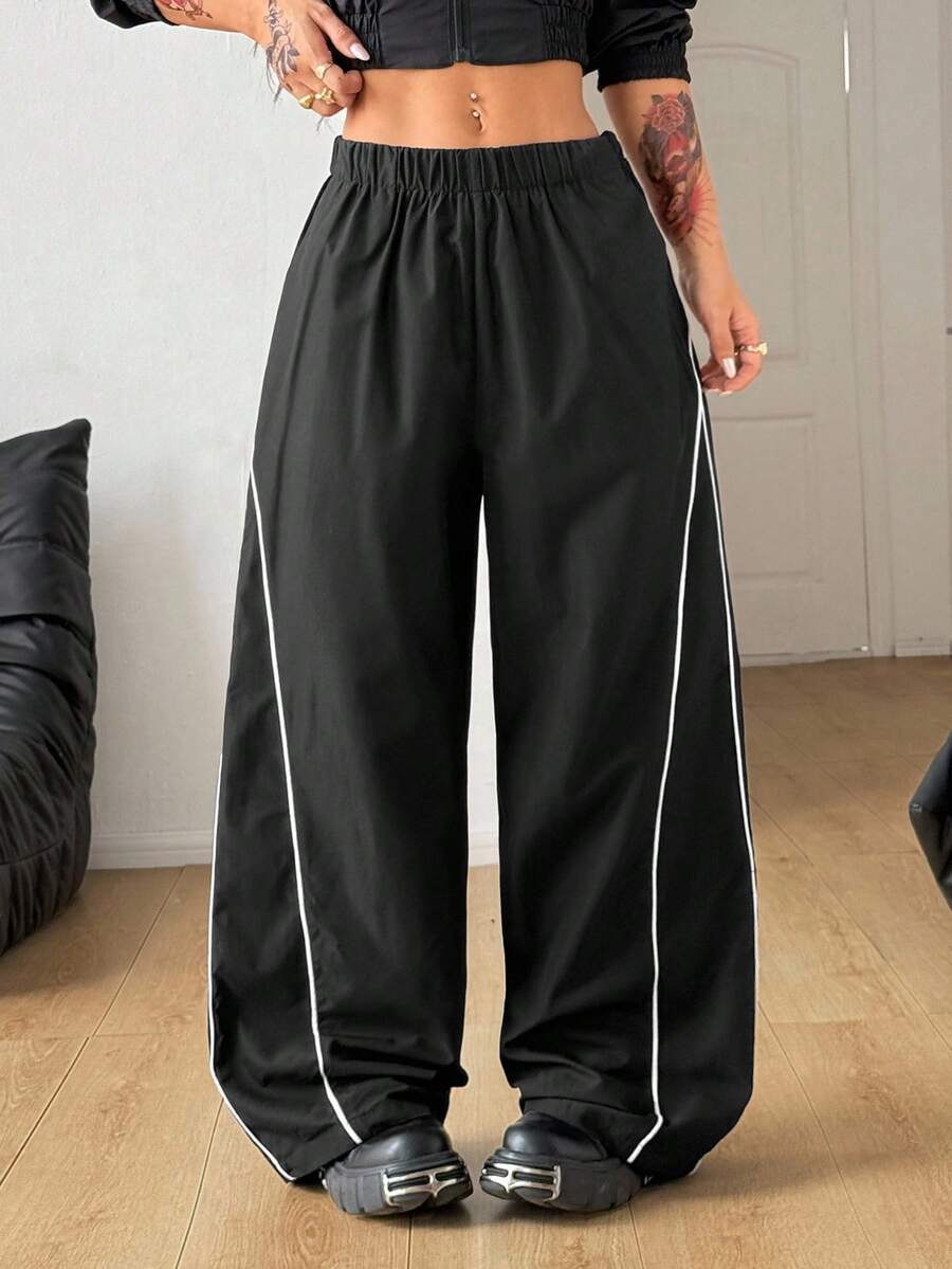 Plus size loose straight leg casual pants with elastic drawstring waist, contrast binding, and side pockets.