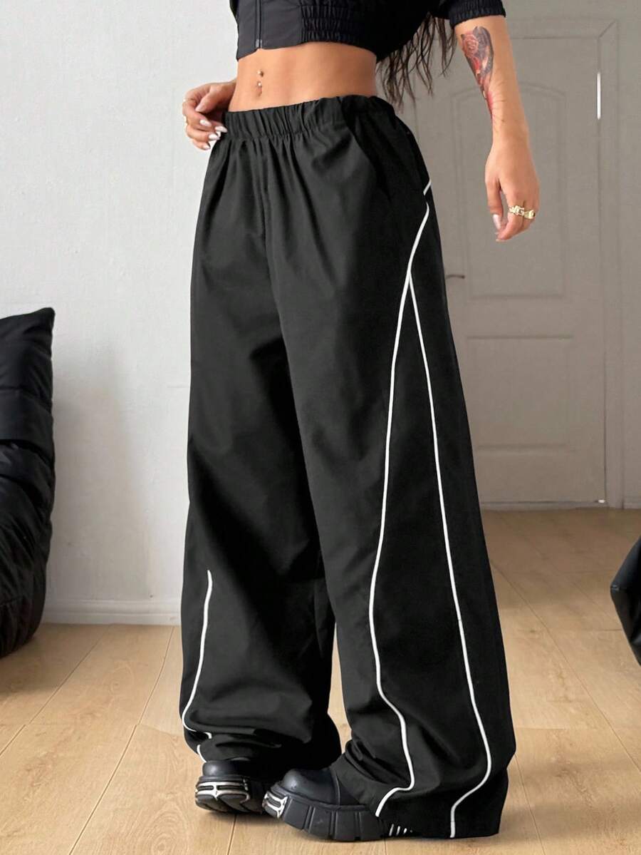Plus size loose straight leg casual pants with elastic drawstring waist, contrast binding, and side pockets.