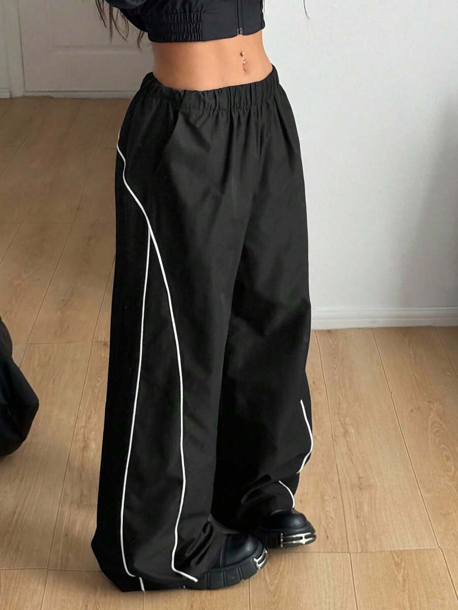 Plus size loose straight leg casual pants with elastic drawstring waist, contrast binding, and side pockets.