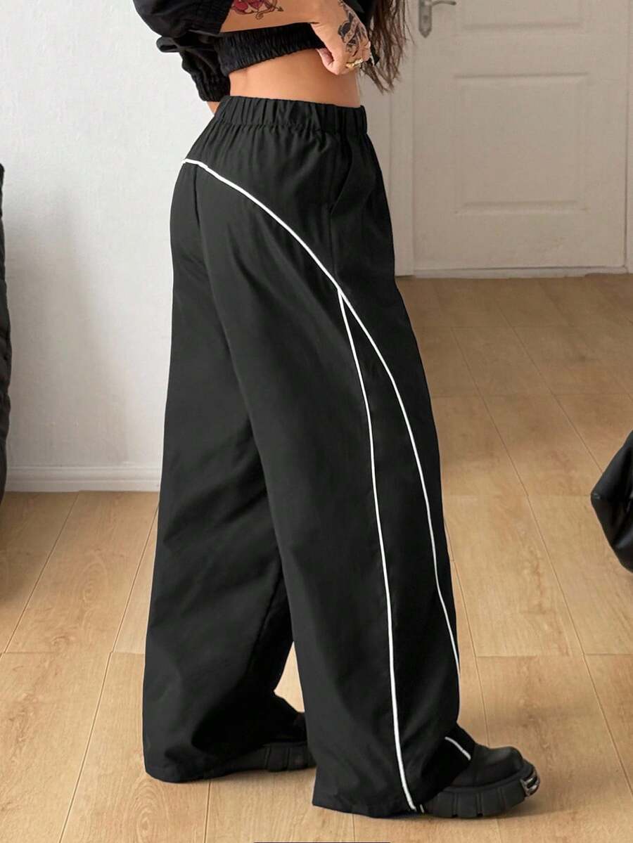 Plus size loose straight leg casual pants with elastic drawstring waist, contrast binding, and side pockets.
