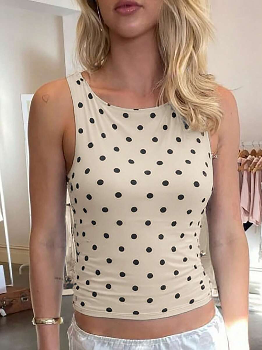 Women's polka dot sleeveless tank top with round neck, ruched rib-knit detail, regular hem, and slim fit casual style