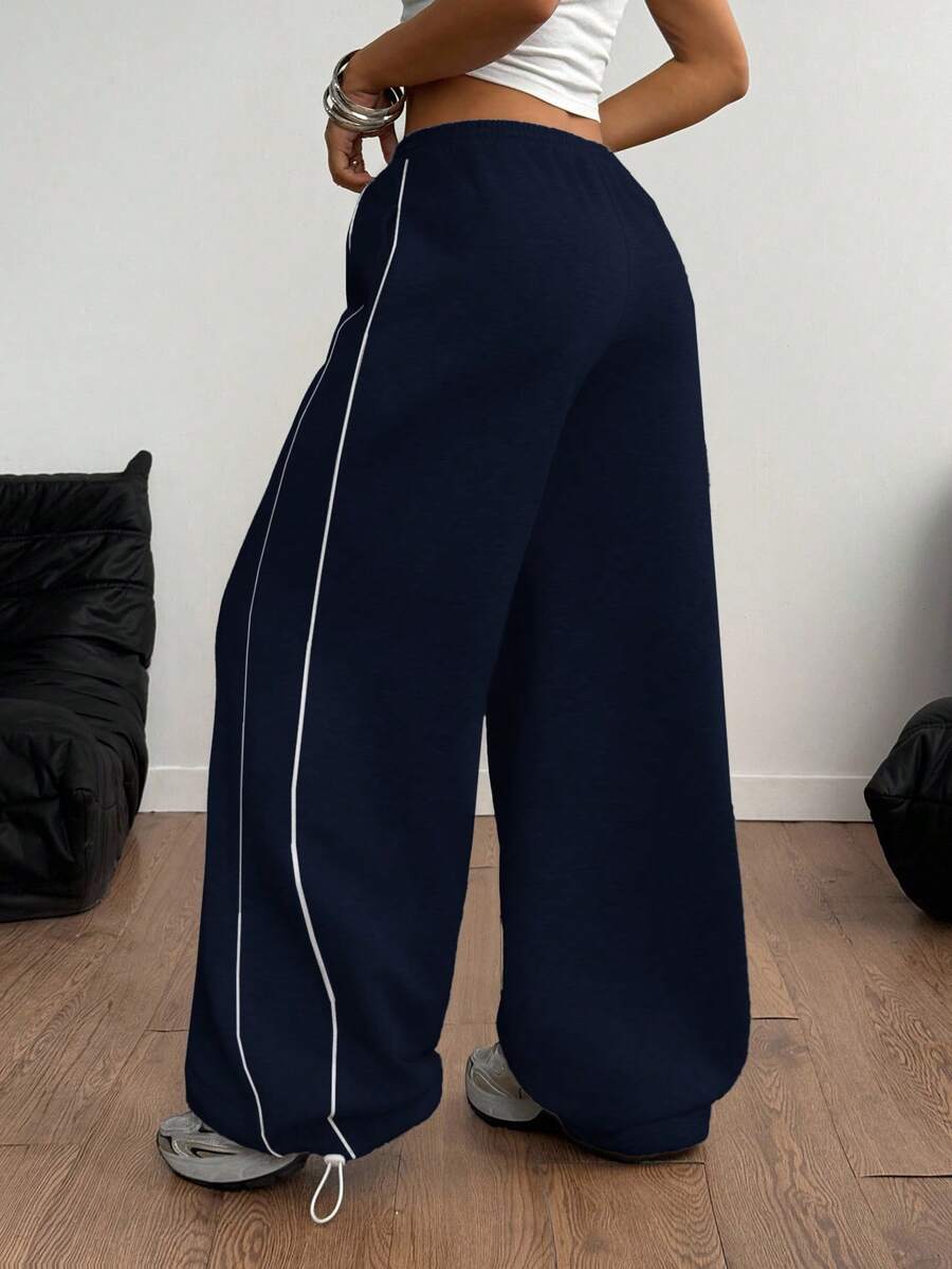 Women's wide leg trousers with a tree branch graphic pattern, loose fit, and mid-rise waist in woven fabric.