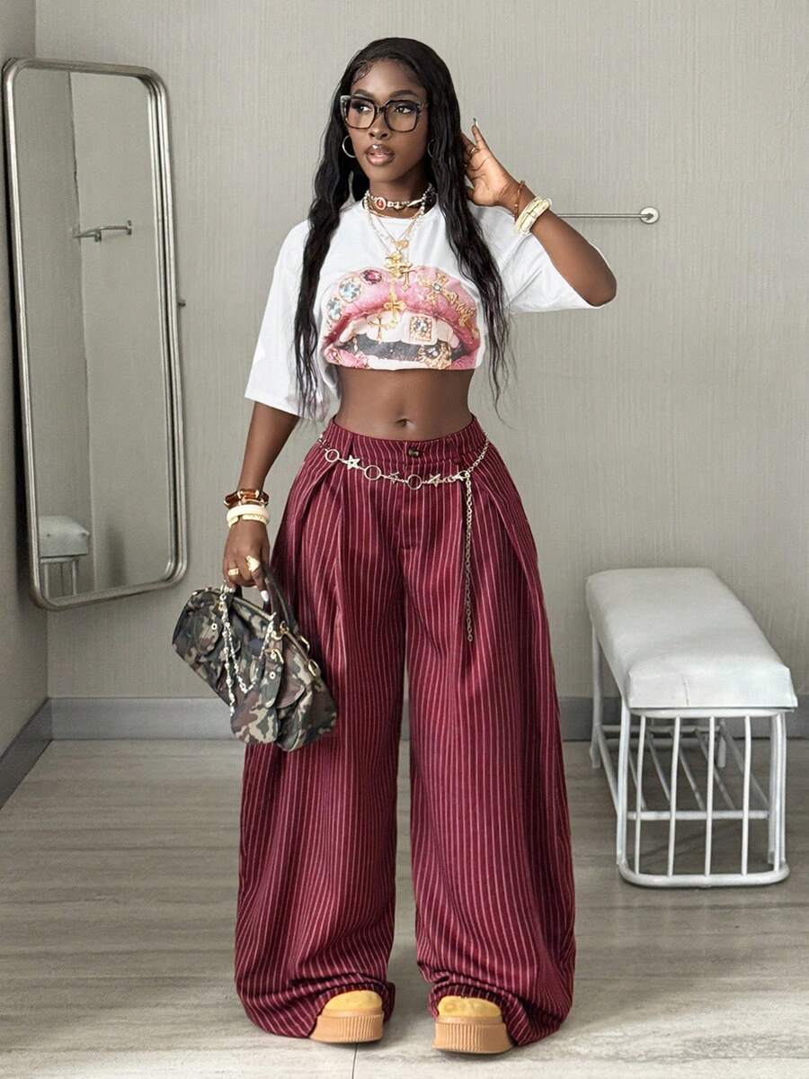 Women's brown striped wide leg pants with a low waist, curved hem, and loose casual fit in woven fabric.