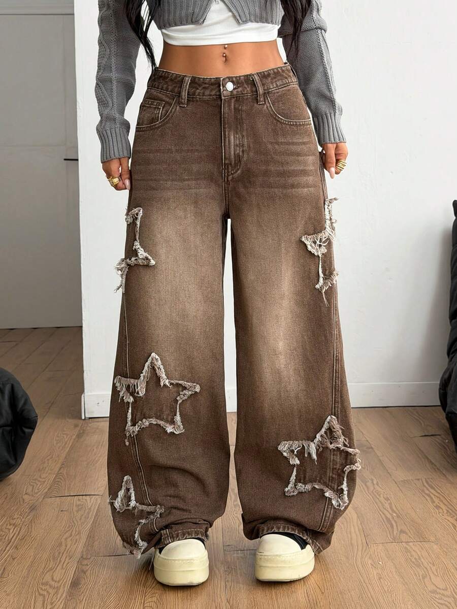Front view of women's loose wide leg denim jeans featuring a mid waist, classic front pockets, and a zipper fly closure.