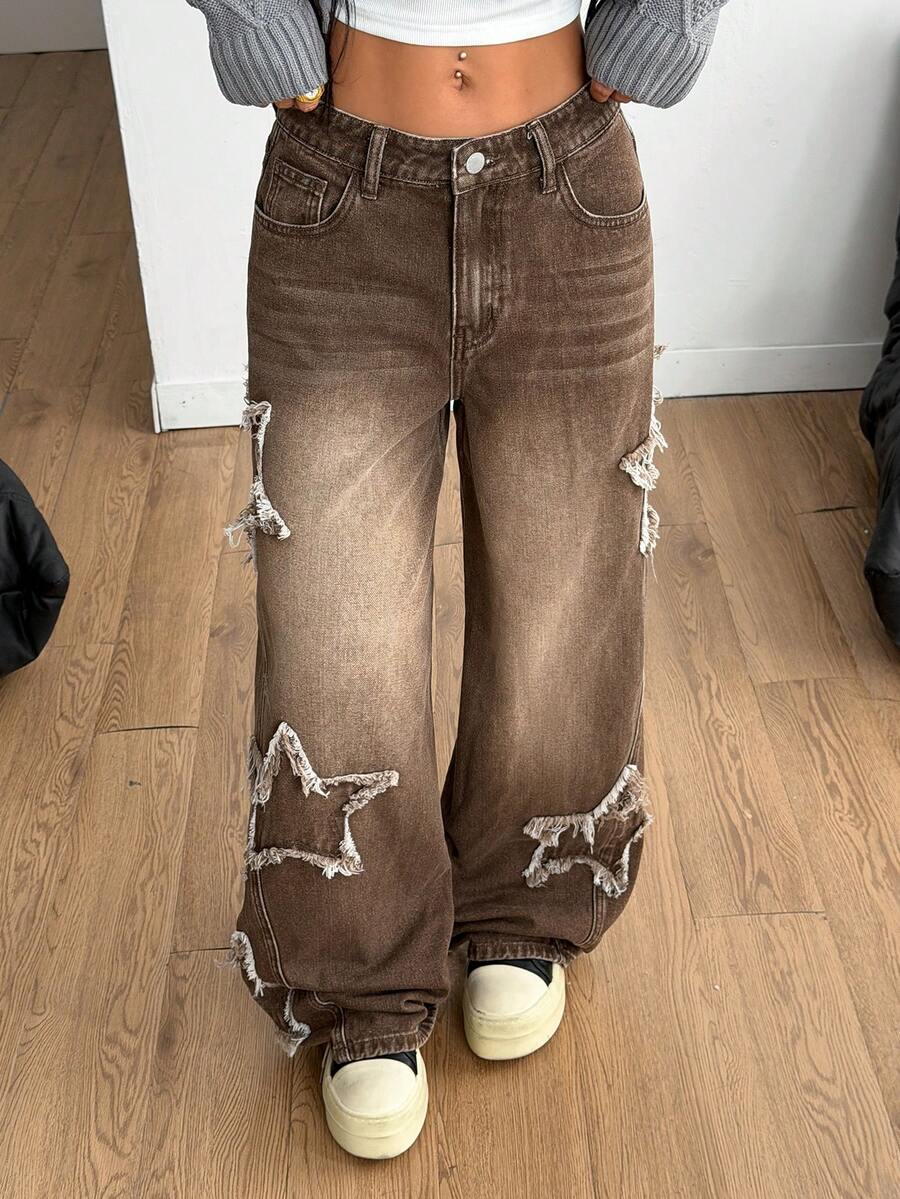Front view of women's loose wide leg denim jeans featuring a mid waist, classic front pockets, and a zipper fly closure.