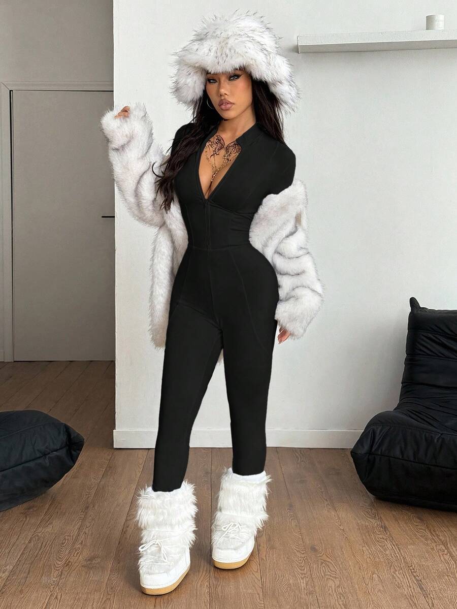 Fitted long sleeve unitard jumpsuit for women featuring a stand collar and front zipper closure in a solid color athletic style.