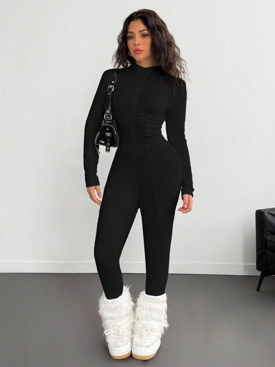 Fitted long sleeve unitard jumpsuit for women featuring a stand collar and front zipper closure in a solid color athletic style.