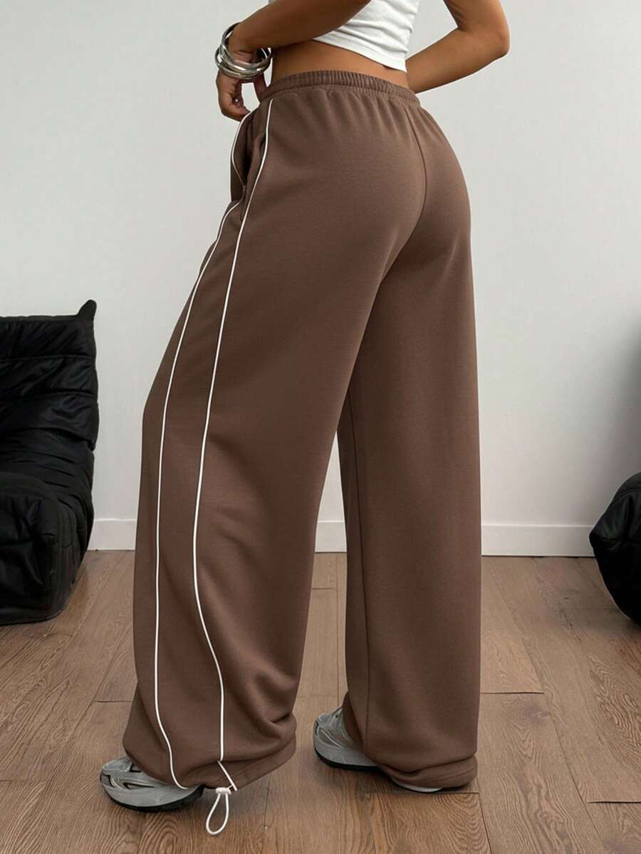 Women's wide leg trousers with a tree branch graphic pattern, loose fit, and mid-rise waist in woven fabric.