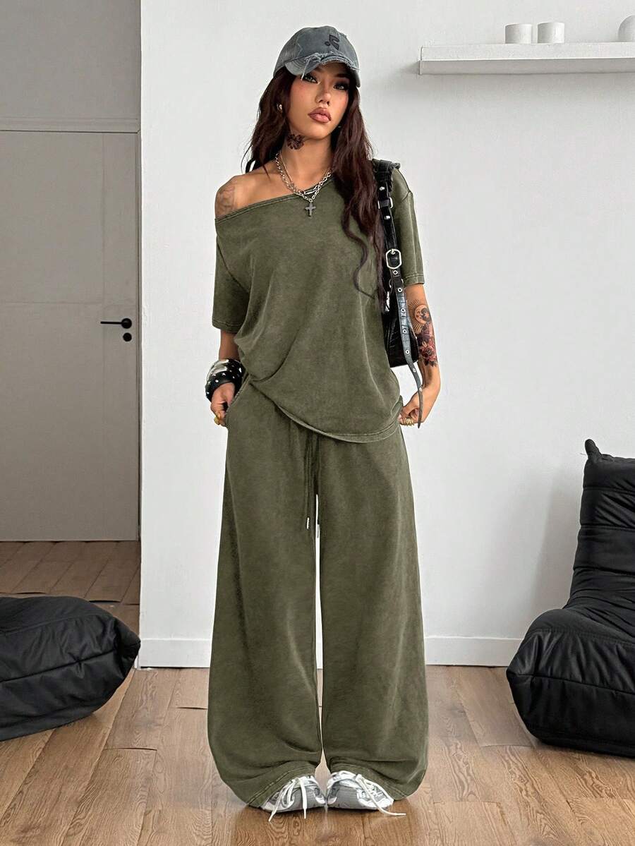 Women's two-piece outfit featuring an oversized asymmetrical neck t-shirt and matching wide-leg drawstring sweatpants.