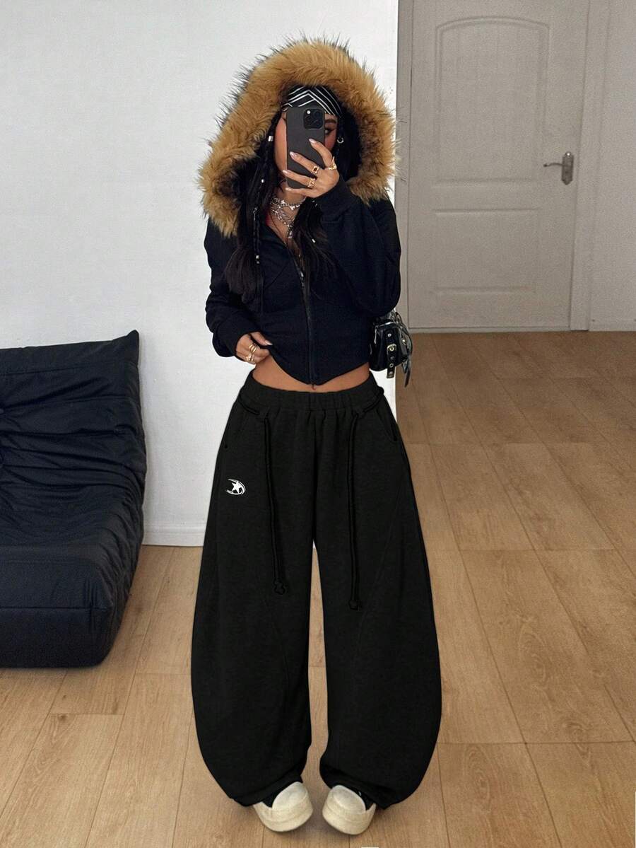 Women's casual grey plaid sweatpants featuring an elastic drawstring waistband, side pockets, and a relaxed loose fit.