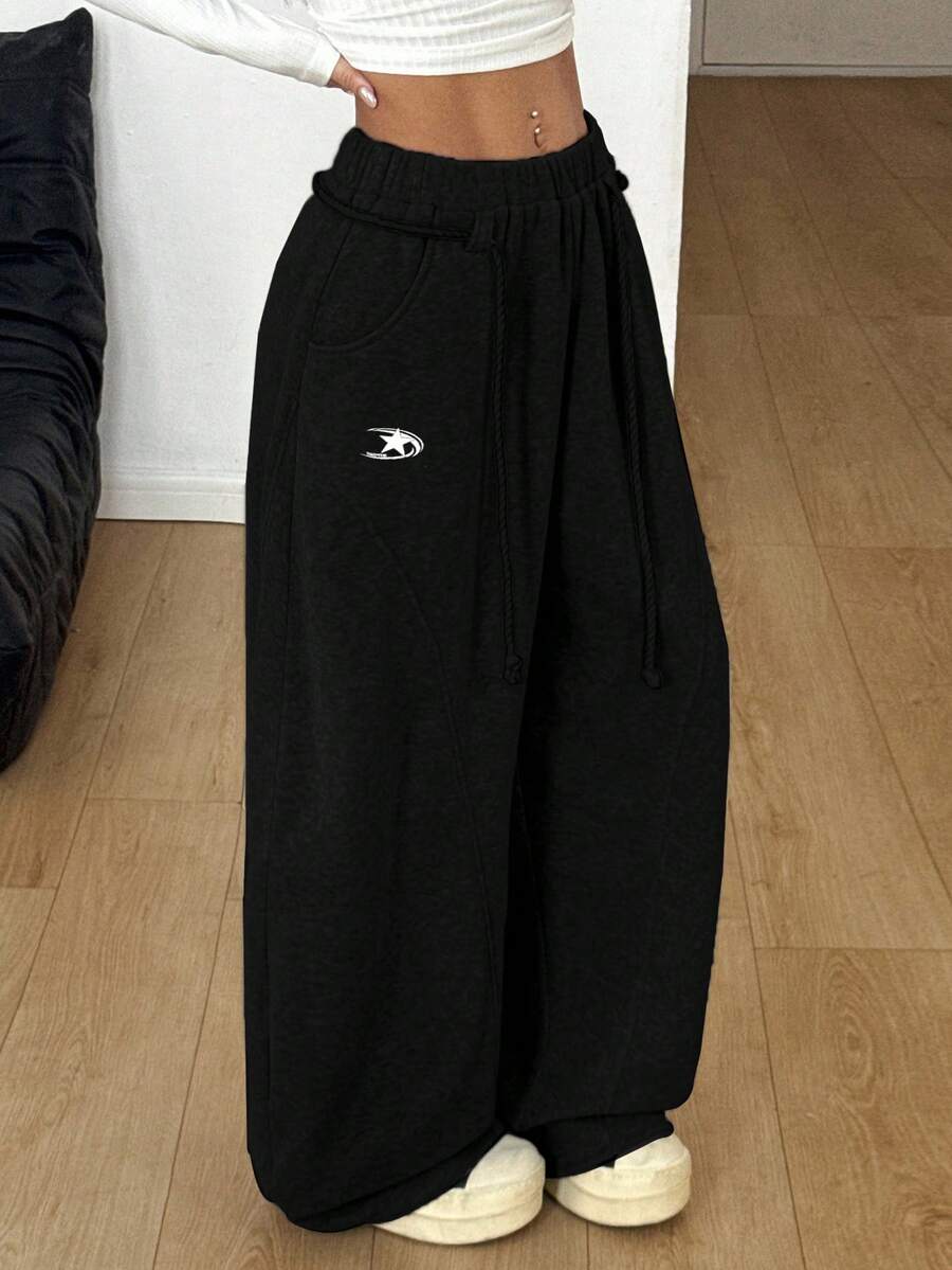 Women's casual grey plaid sweatpants featuring an elastic drawstring waistband, side pockets, and a relaxed loose fit.