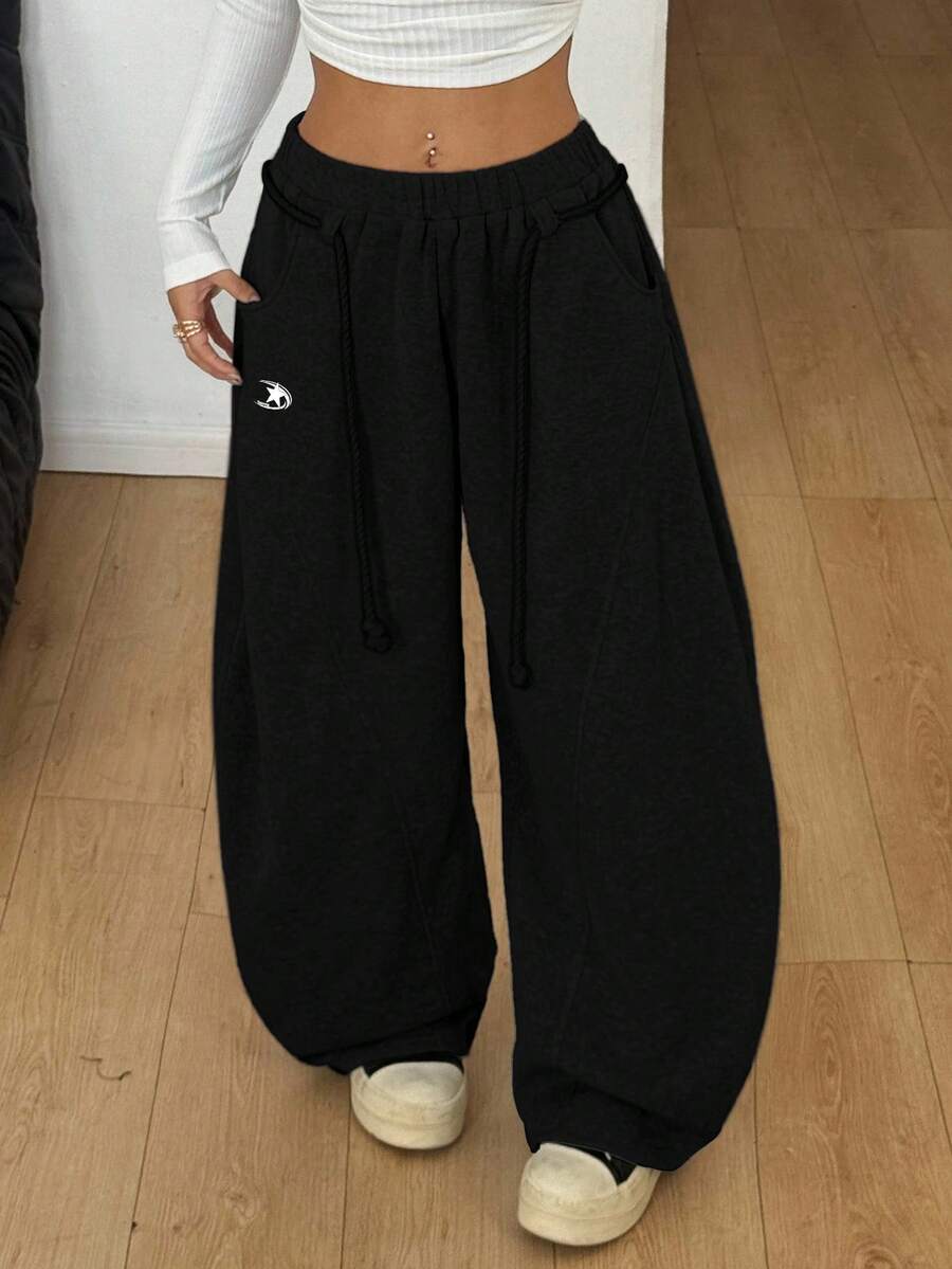 Women's casual grey plaid sweatpants featuring an elastic drawstring waistband, side pockets, and a relaxed loose fit.