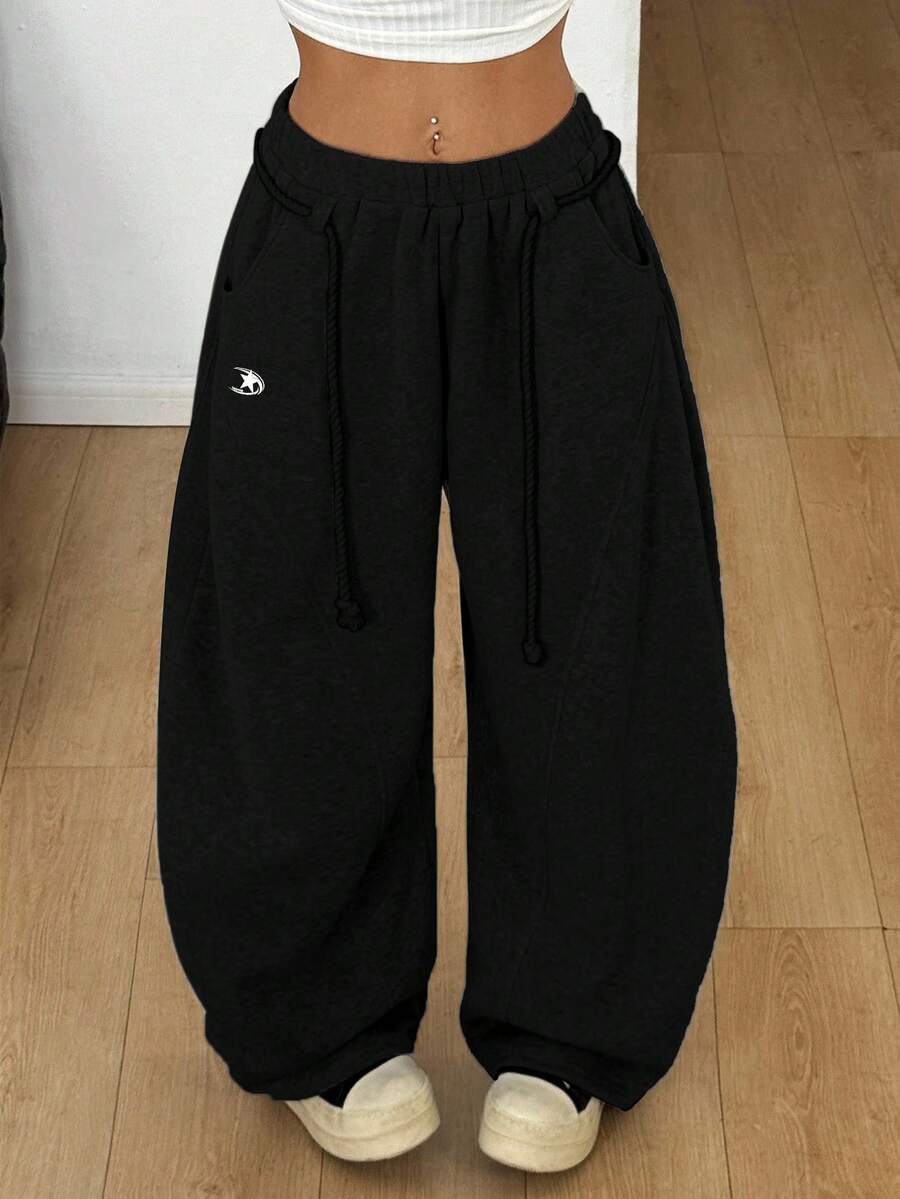 Women's casual grey plaid sweatpants featuring an elastic drawstring waistband, side pockets, and a relaxed loose fit.