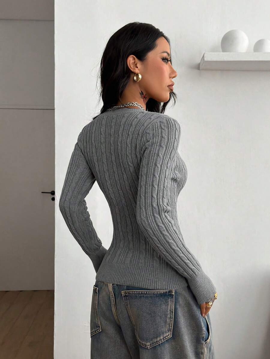 Women's slim fit cable-knit sweater with a V-neckline and long sleeves in solid green rib knit fabric.