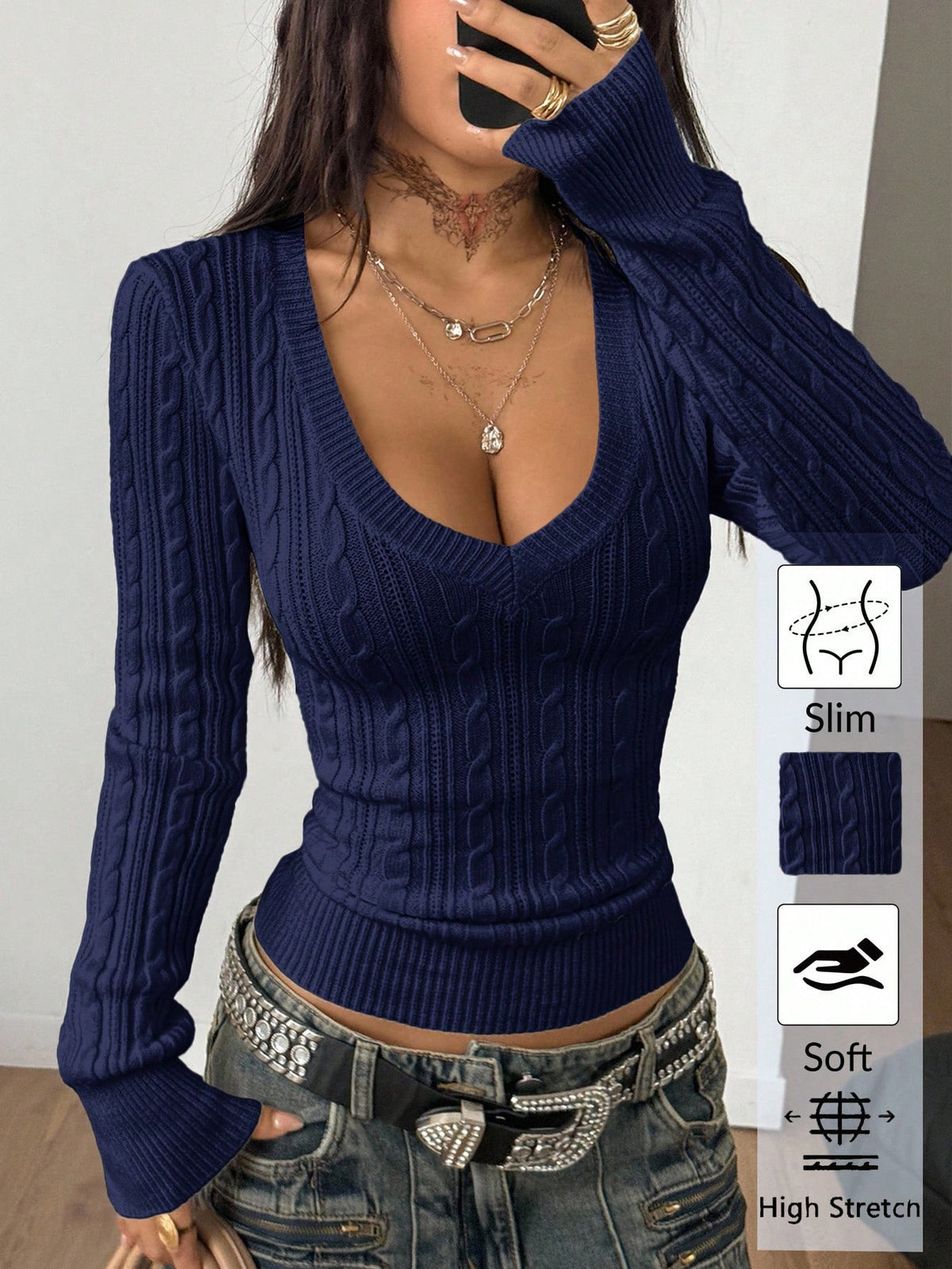 Women's slim fit cable-knit sweater with a V-neckline and long sleeves in solid green rib knit fabric.