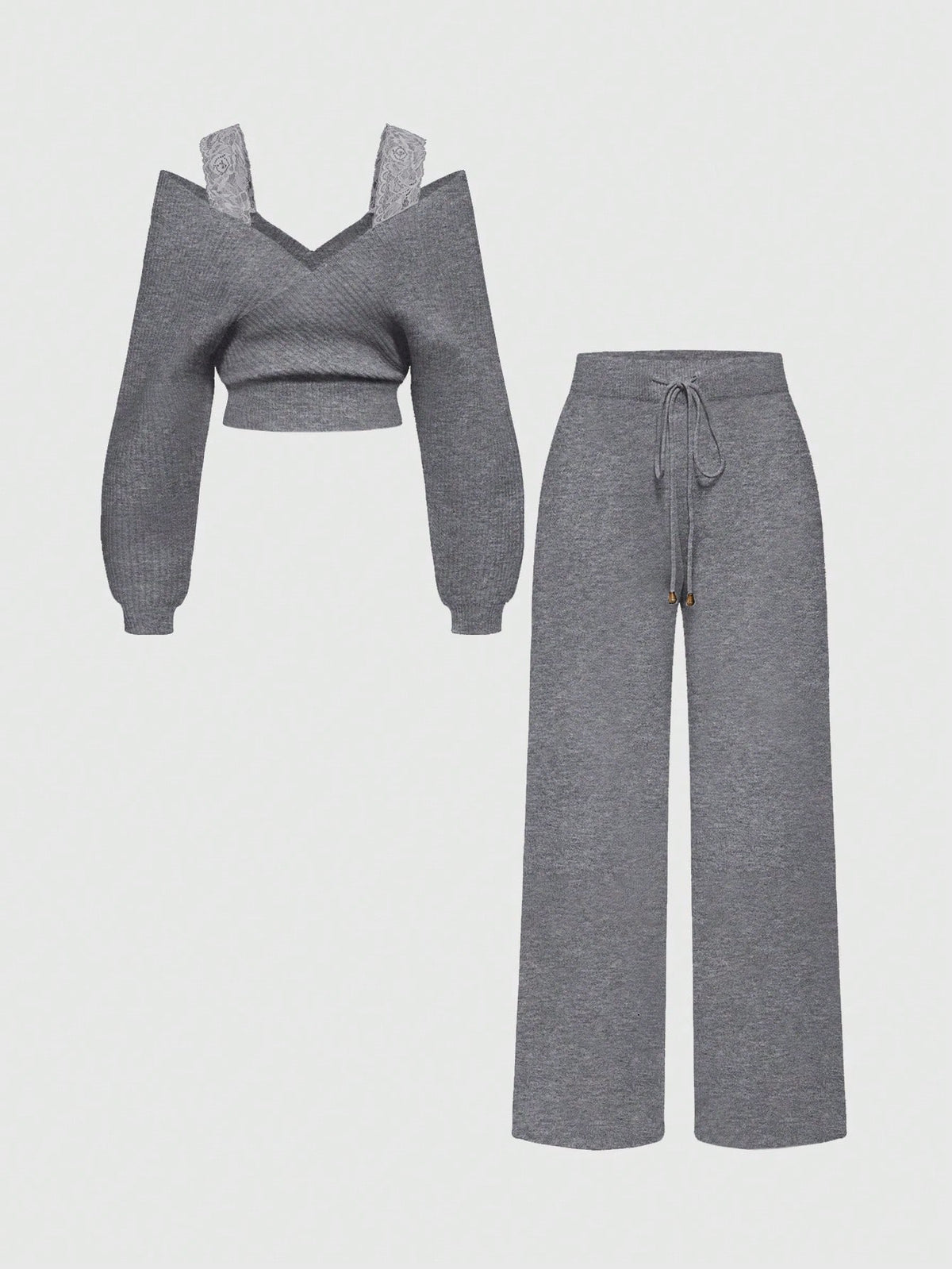 Women's two-piece rib-knit sweater set featuring a long-sleeve cold-shoulder crop top with strap details and matching wide-leg pants.