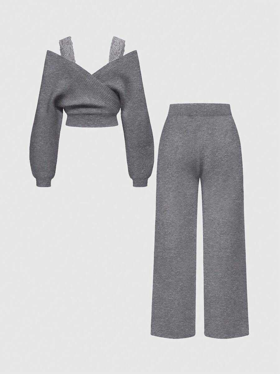 Women's two-piece rib-knit sweater set featuring a long-sleeve cold-shoulder crop top with strap details and matching wide-leg pants.