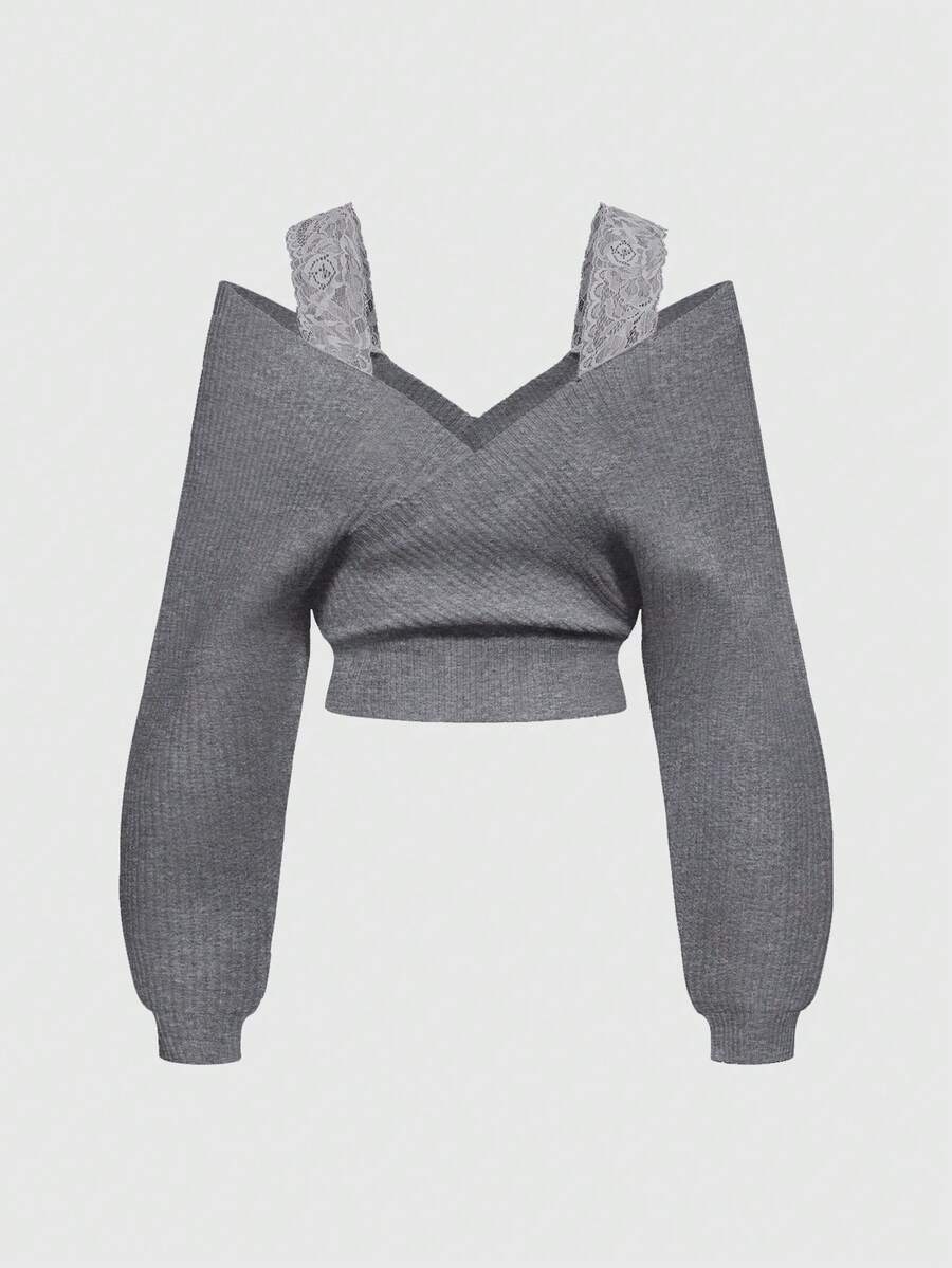 Women's two-piece rib-knit sweater set featuring a long-sleeve cold-shoulder crop top with strap details and matching wide-leg pants.