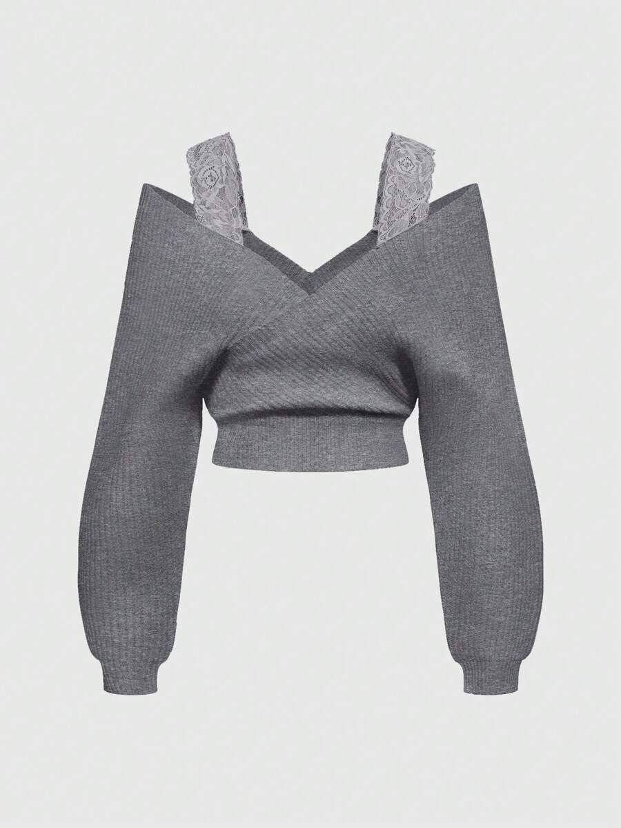 Women's two-piece rib-knit sweater set featuring a long-sleeve cold-shoulder crop top with strap details and matching wide-leg pants.