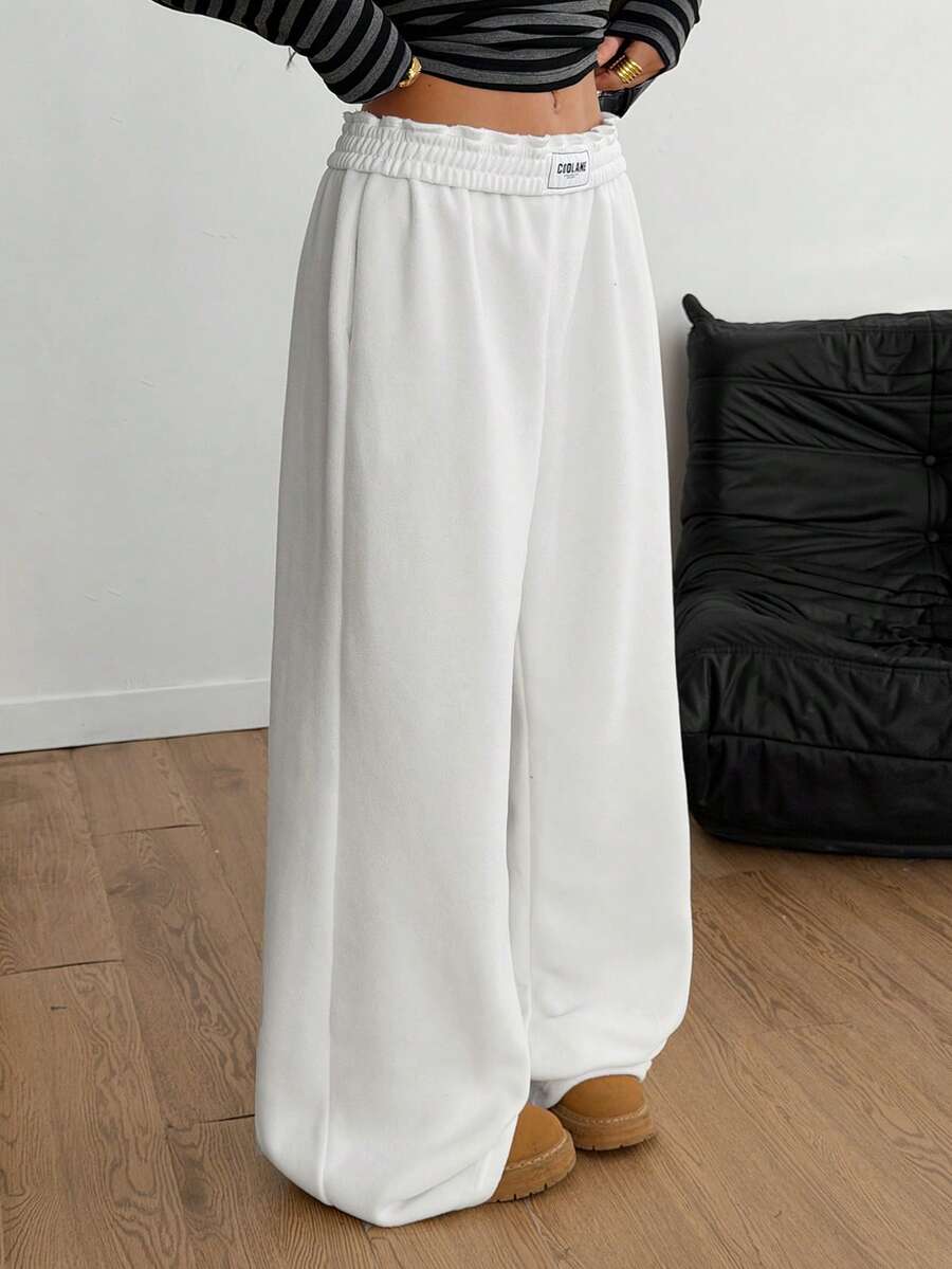 Women's striped straight leg casual trousers with elastic mid waist and side pockets