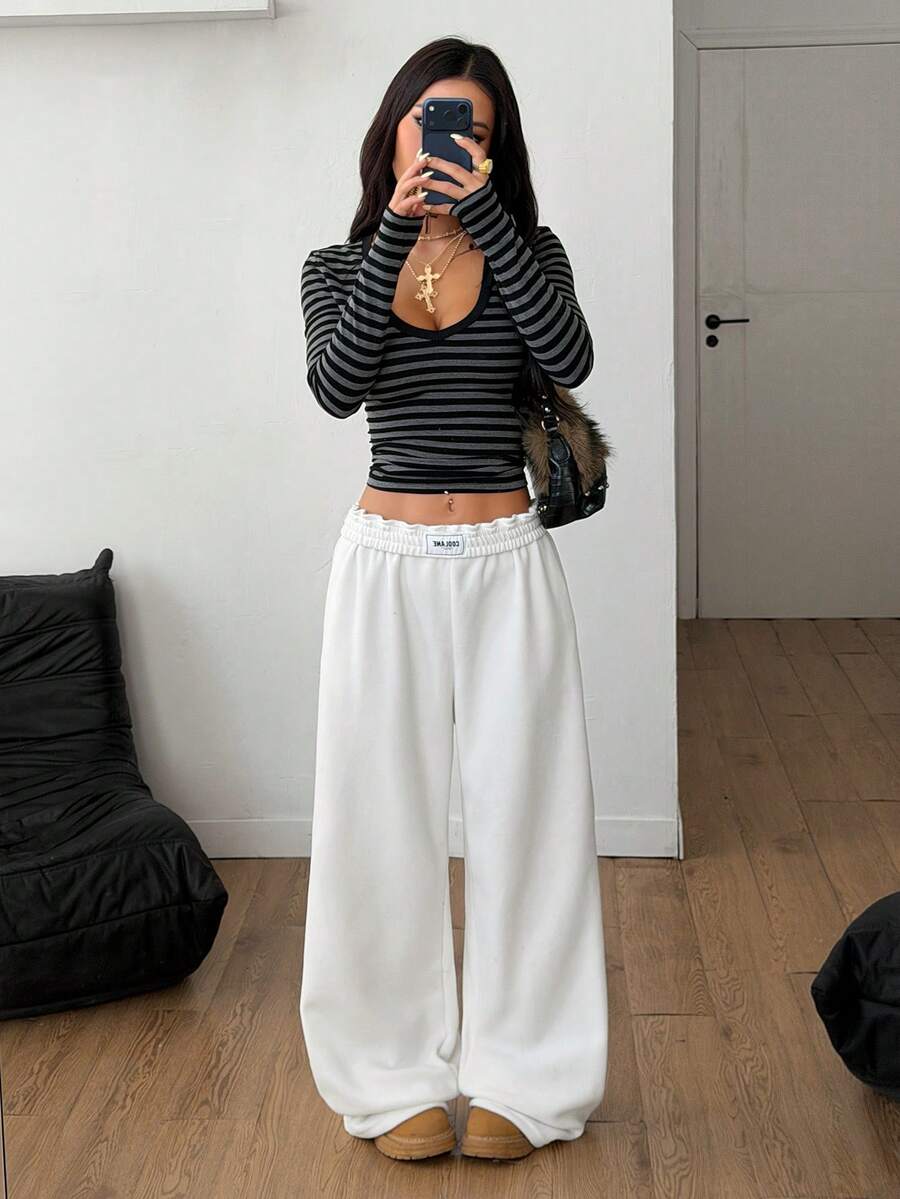 Women's striped straight leg casual trousers with elastic mid waist and side pockets