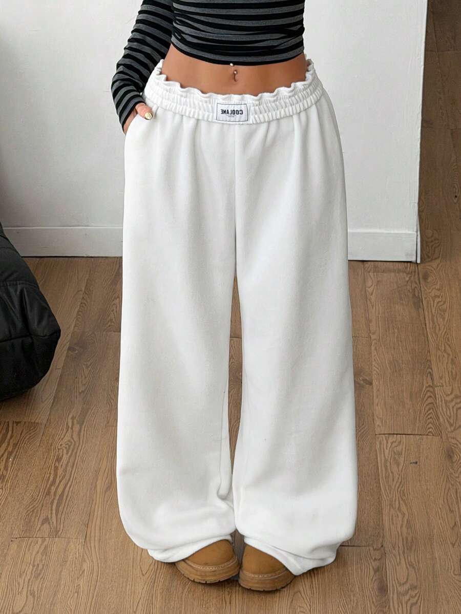 Women's striped straight leg casual trousers with elastic mid waist and side pockets