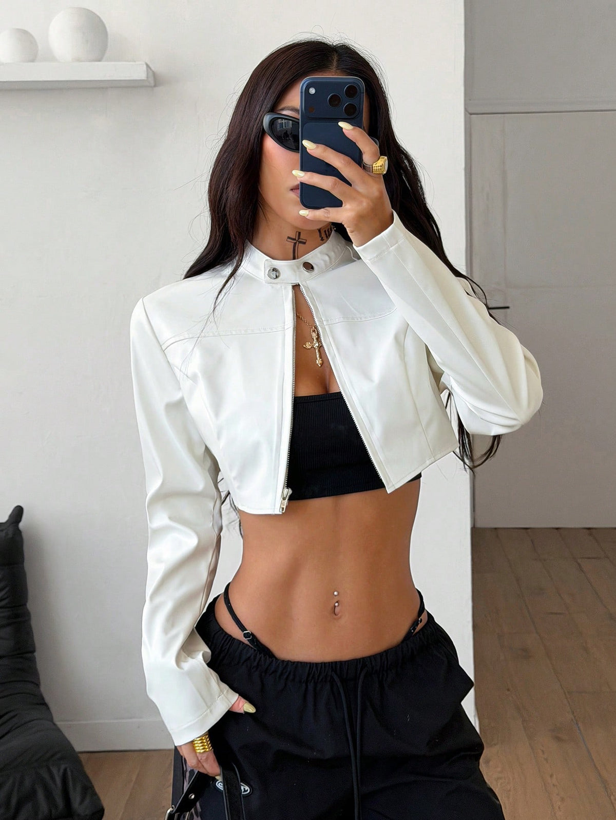 Women's metallic grey cropped faux leather jacket featuring a stand collar and asymmetrical zip front closure.