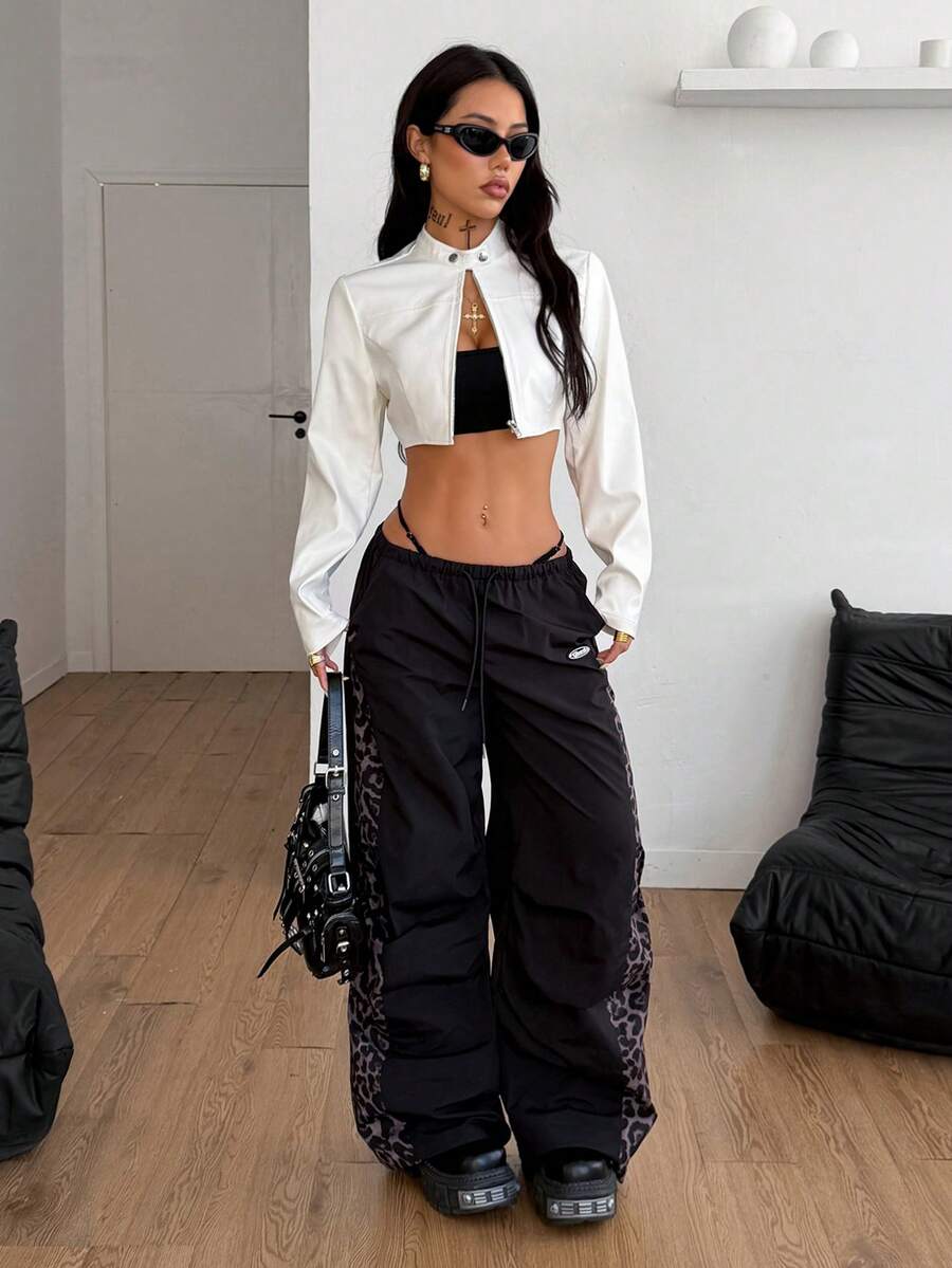 Women's metallic grey cropped faux leather jacket featuring a stand collar and asymmetrical zip front closure.