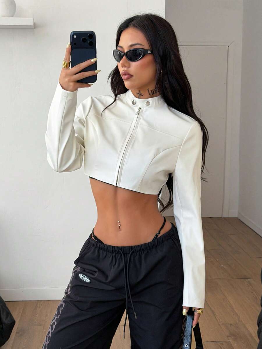 Women's metallic grey cropped faux leather jacket featuring a stand collar and asymmetrical zip front closure.