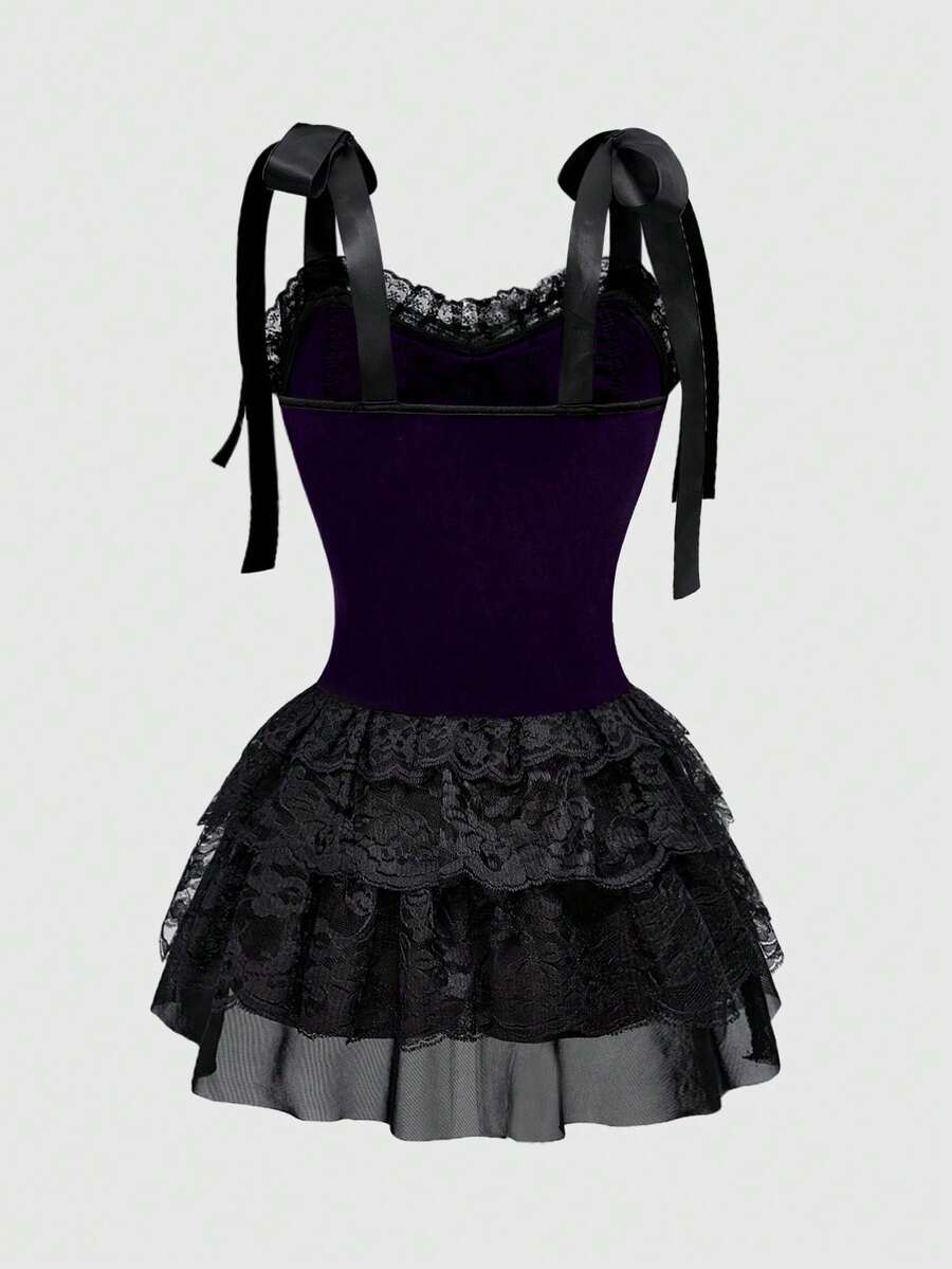 Gothic velvet halter mini dress with contrast lace trim, bow detail, lace-up accents, arm sleeves, layered hem, and cross pendant.