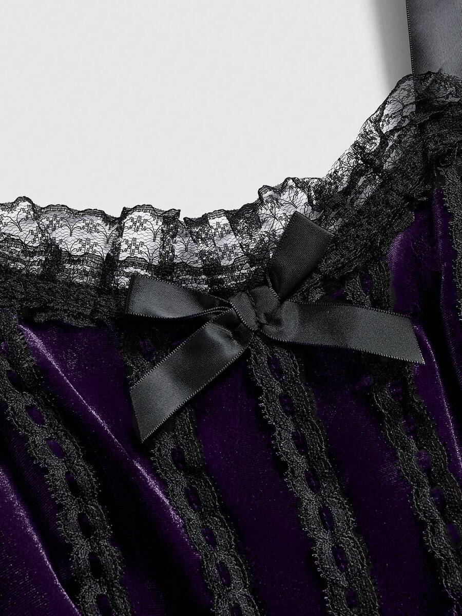 Gothic velvet halter mini dress with contrast lace trim, bow detail, lace-up accents, arm sleeves, layered hem, and cross pendant.
