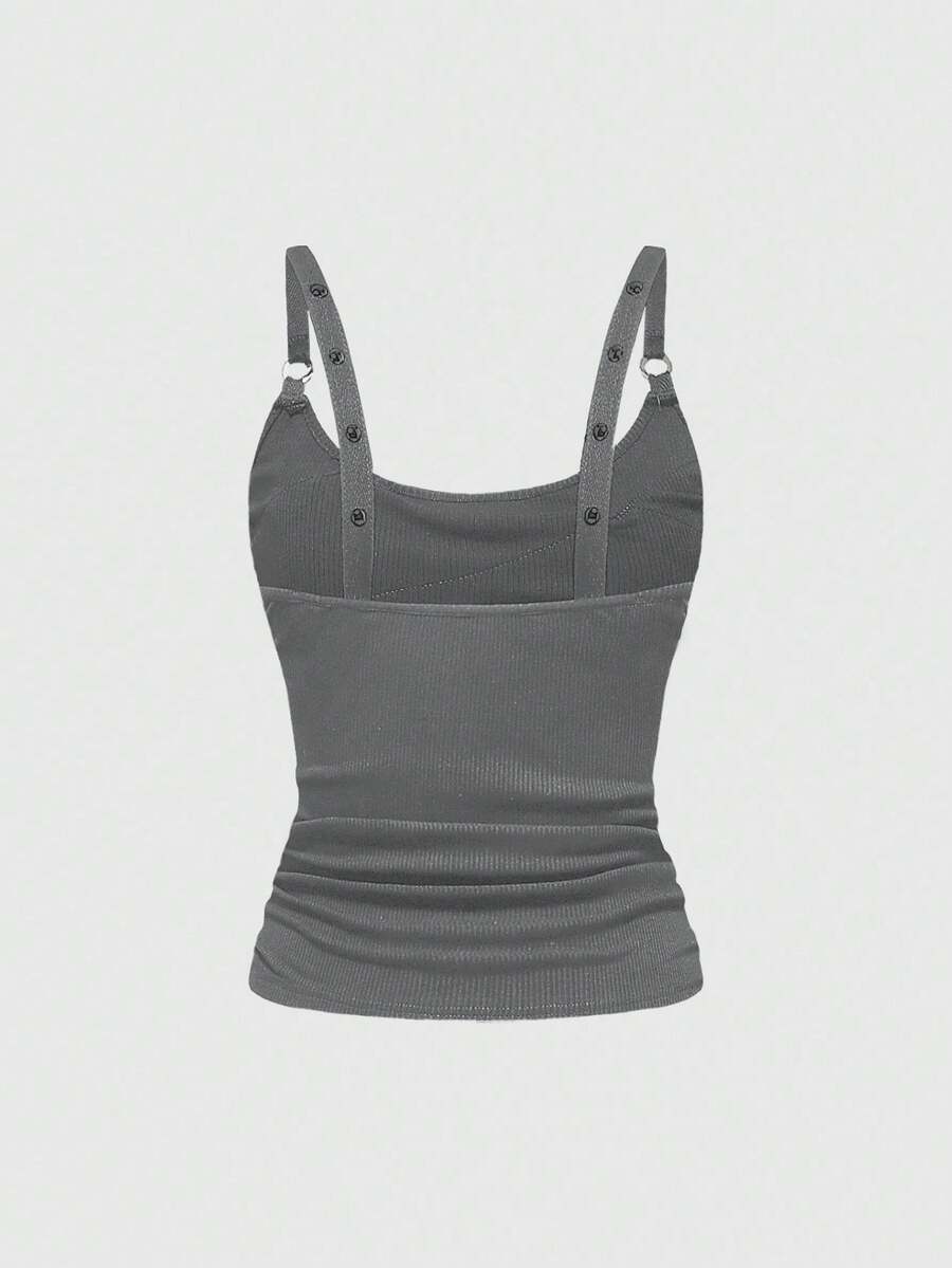 Women's wide-strap cami top featuring a grunge punk design with cut-out details, rhinestone embellishments, and grommet eyelets.