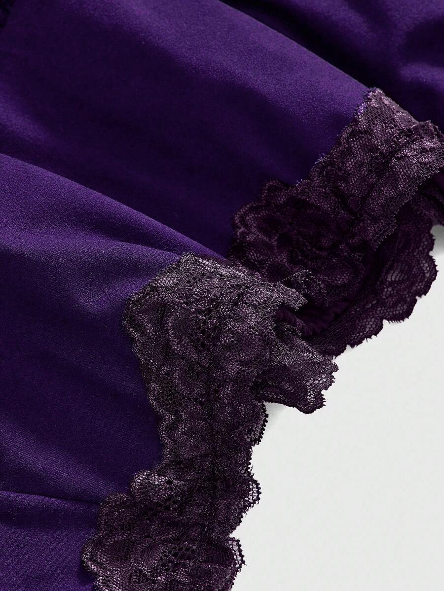 Women's black low-waist mini skirt with drawstring tie, ruched details, lace trim, layered ruffle hem, and asymmetric styling