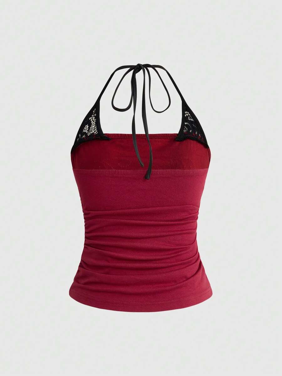 Women's cropped Y2K punk print halter cami top with contrast lace, backless knot detail, and slim fit knitted fabric