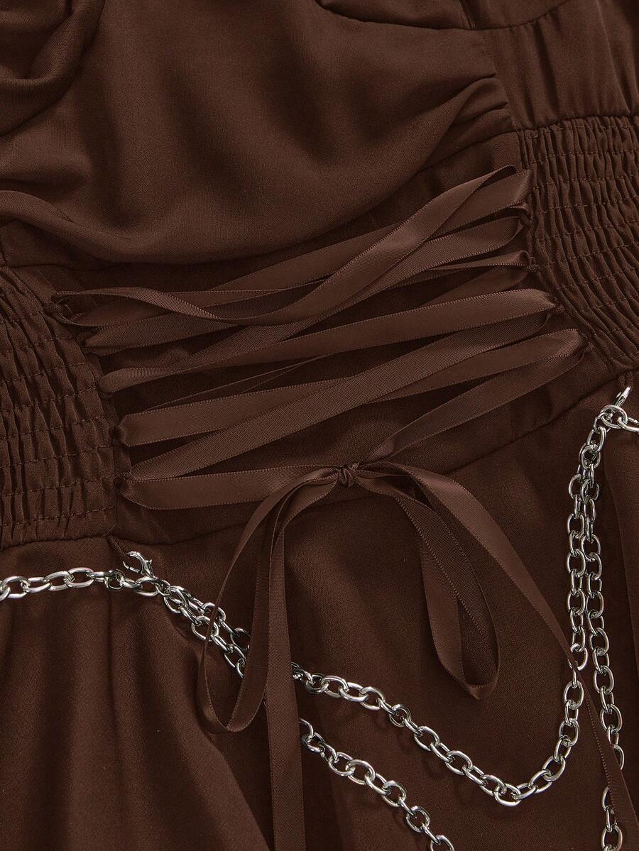Women's vintage gothic cami dress with high-waist lace-up detail, spaghetti straps, zipper closure, and an asymmetrical knee-length hem.