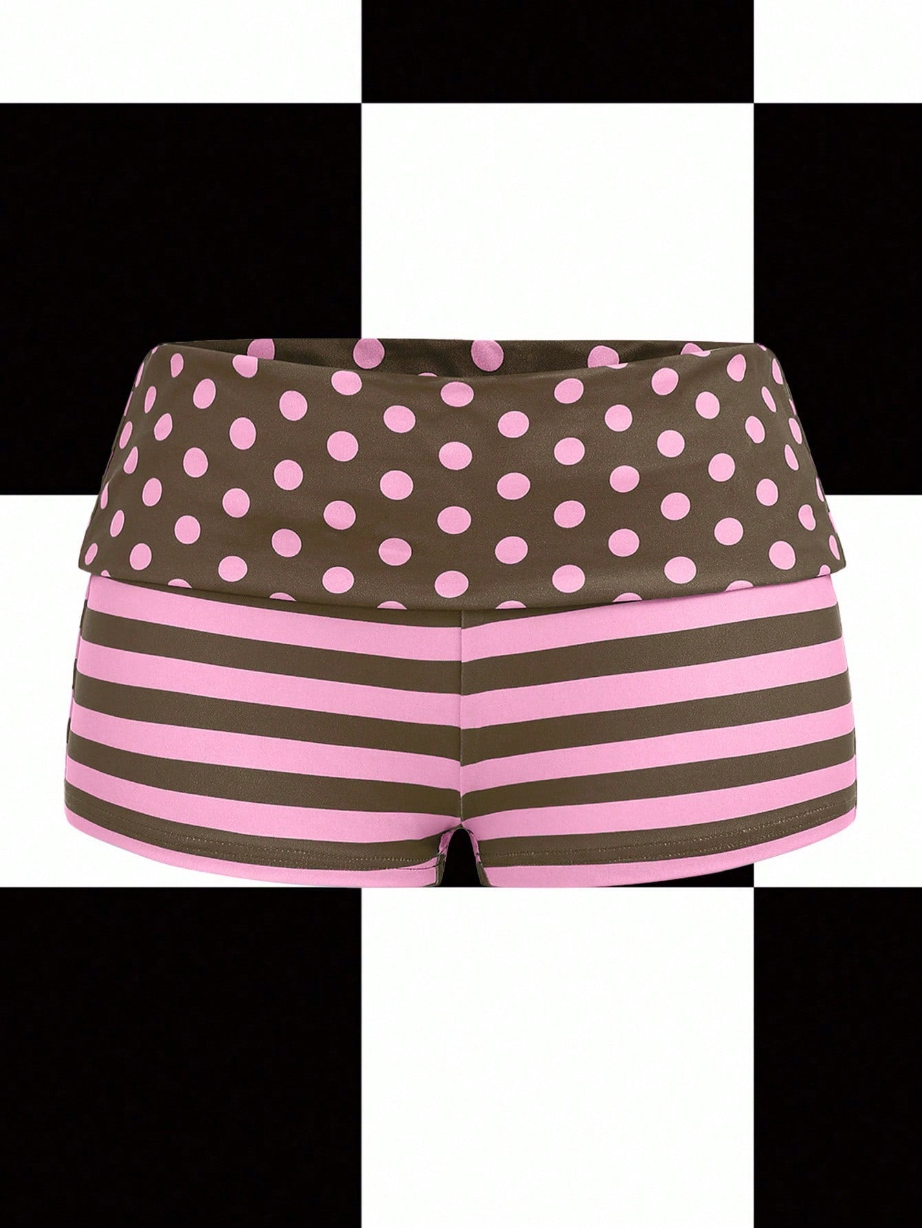 Women's black low waist mini track shorts with contrast polka dot, striped, geometric, and plant-inspired print details, elastic waistband, and skinny fit