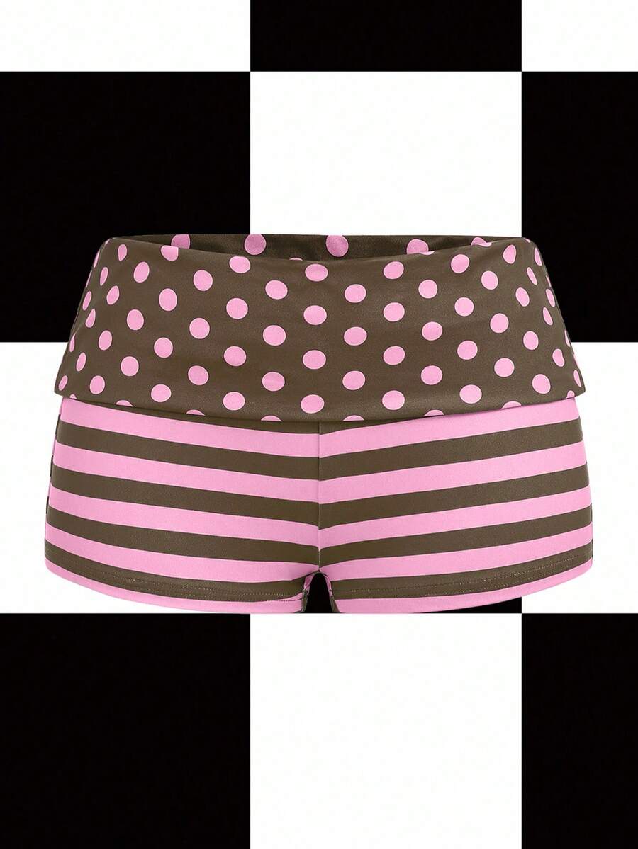 Women's black low waist mini track shorts with contrast polka dot, striped, geometric, and plant-inspired print details, elastic waistband, and skinny fit