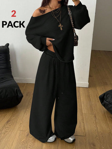 Women's two-piece casual lounge set featuring a loose drop-shoulder long sleeve sweatshirt and high-waist drawstring sweatpants with pockets.