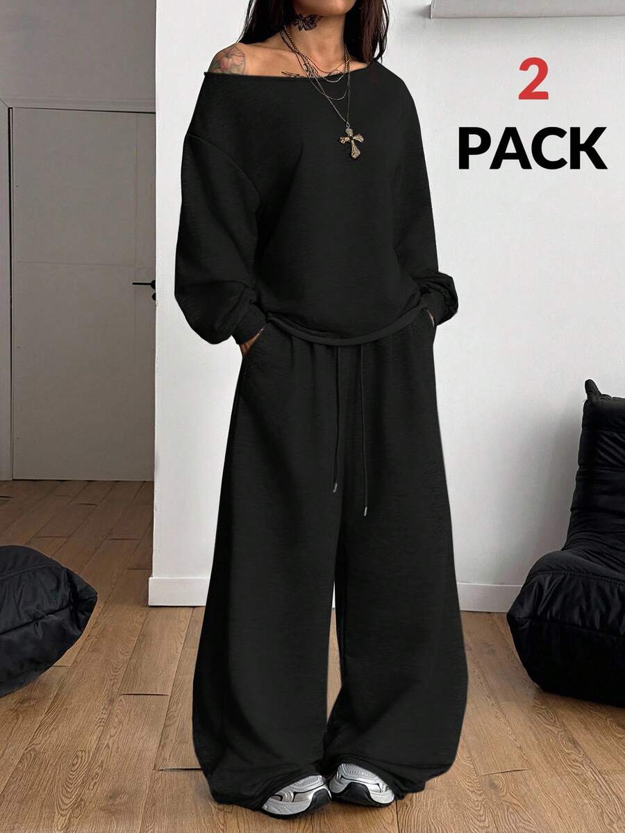 Women's two-piece casual lounge set featuring a loose drop-shoulder long sleeve sweatshirt and high-waist drawstring sweatpants with pockets.