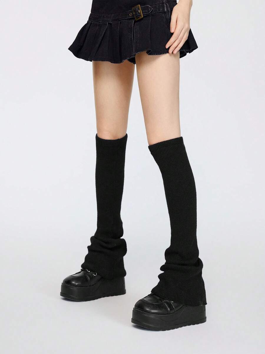 Pair of women's extra long knitted leg warmers featuring a gothic grunge design with subtle ruffle detailing.